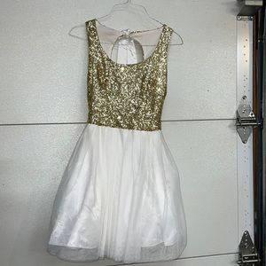 B. Darlin gold sparkled top white bottom dress.